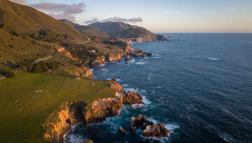 Drone aerial photo of the Big Sur coastline near Garrapata State Park at sunset along the California coast