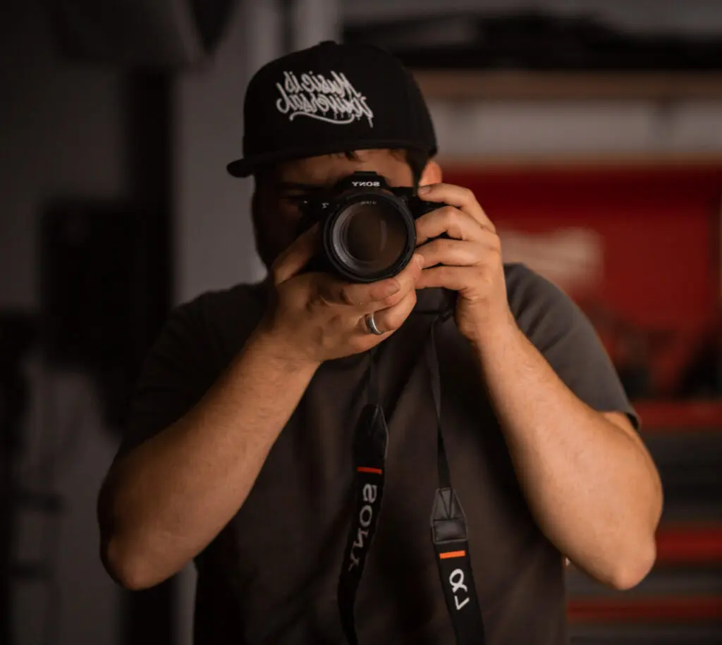 Person holding camera, taking photo