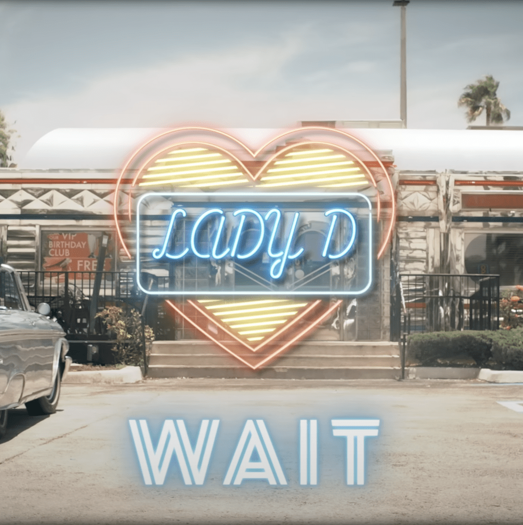 Title card with neon heart sign reading LADY D and the word WAIT outside a diner
