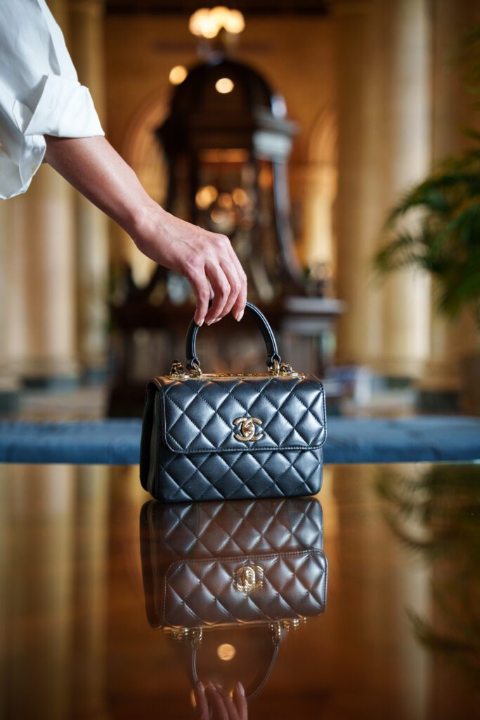 Brown leather bag product photography with model – commercial photographer and filmmaker Hollywood Florida