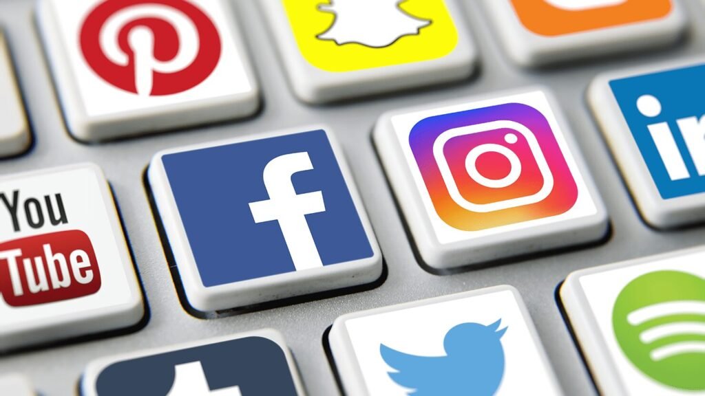 Close-up of keyboard keys printed with assorted social media app logos