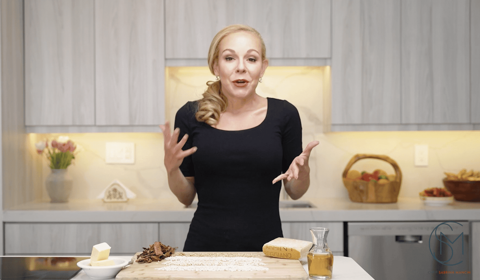Woman cooking in modern kitchen setting