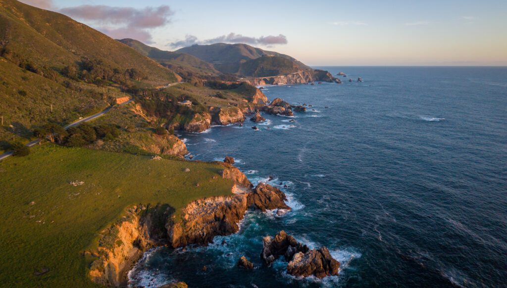 Drone aerial photo of the Big Sur coastline near Garrapata State Park at sunset along the California coast