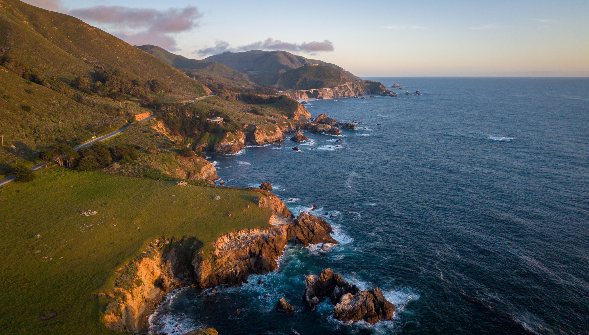 Drone aerial photo of the Big Sur coastline near Garrapata State Park at sunset along the California coast