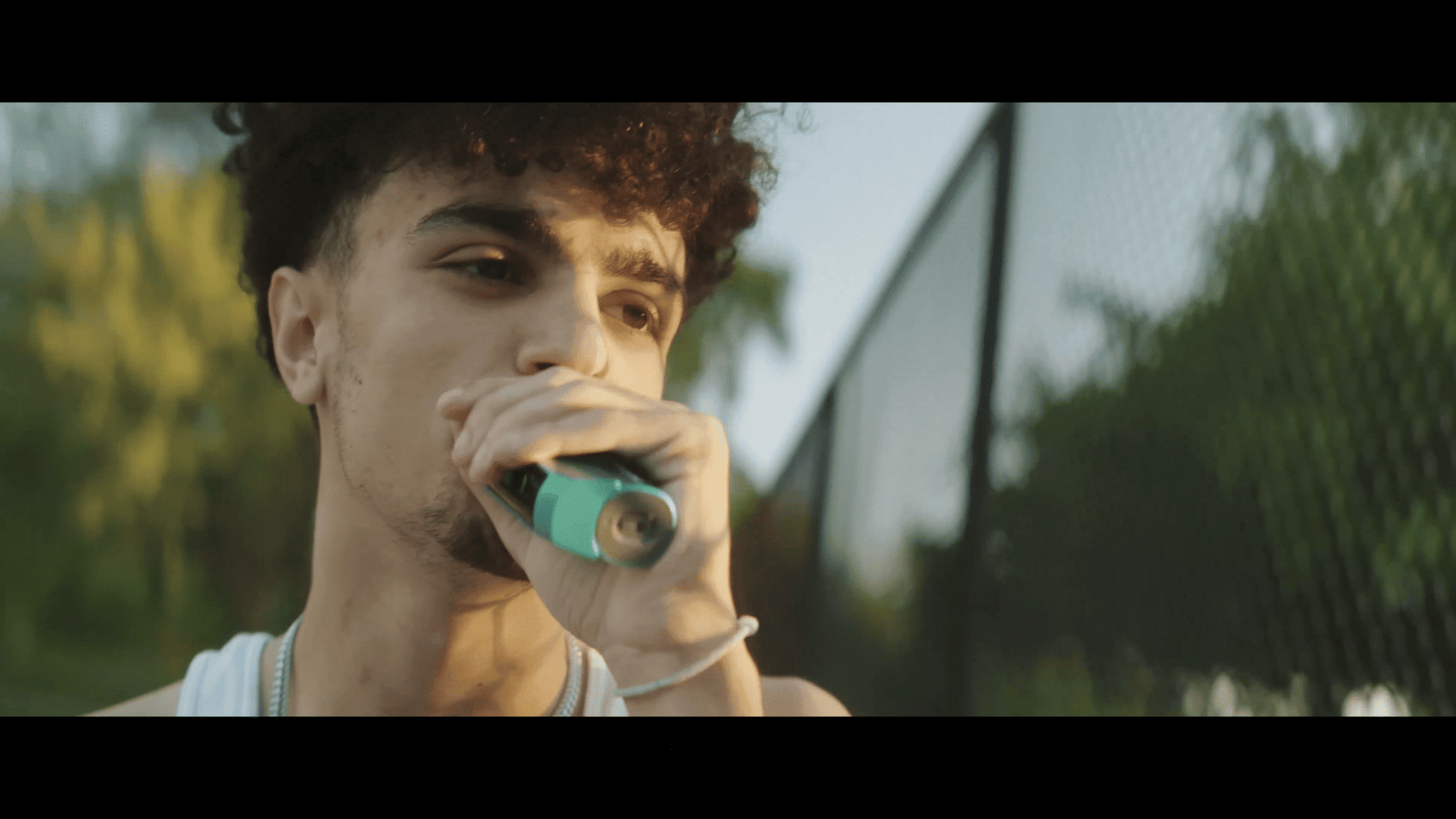 Young man smoking a vape outdoors