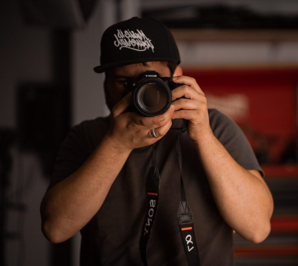 Person holding camera, taking photo