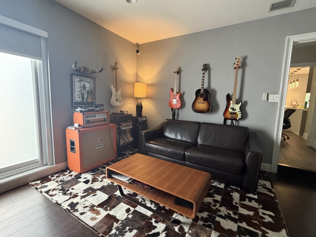 IMG 0670 Music lounge area at Dov Gurewicz Productions studio, with guitars, bass, and vintage amp