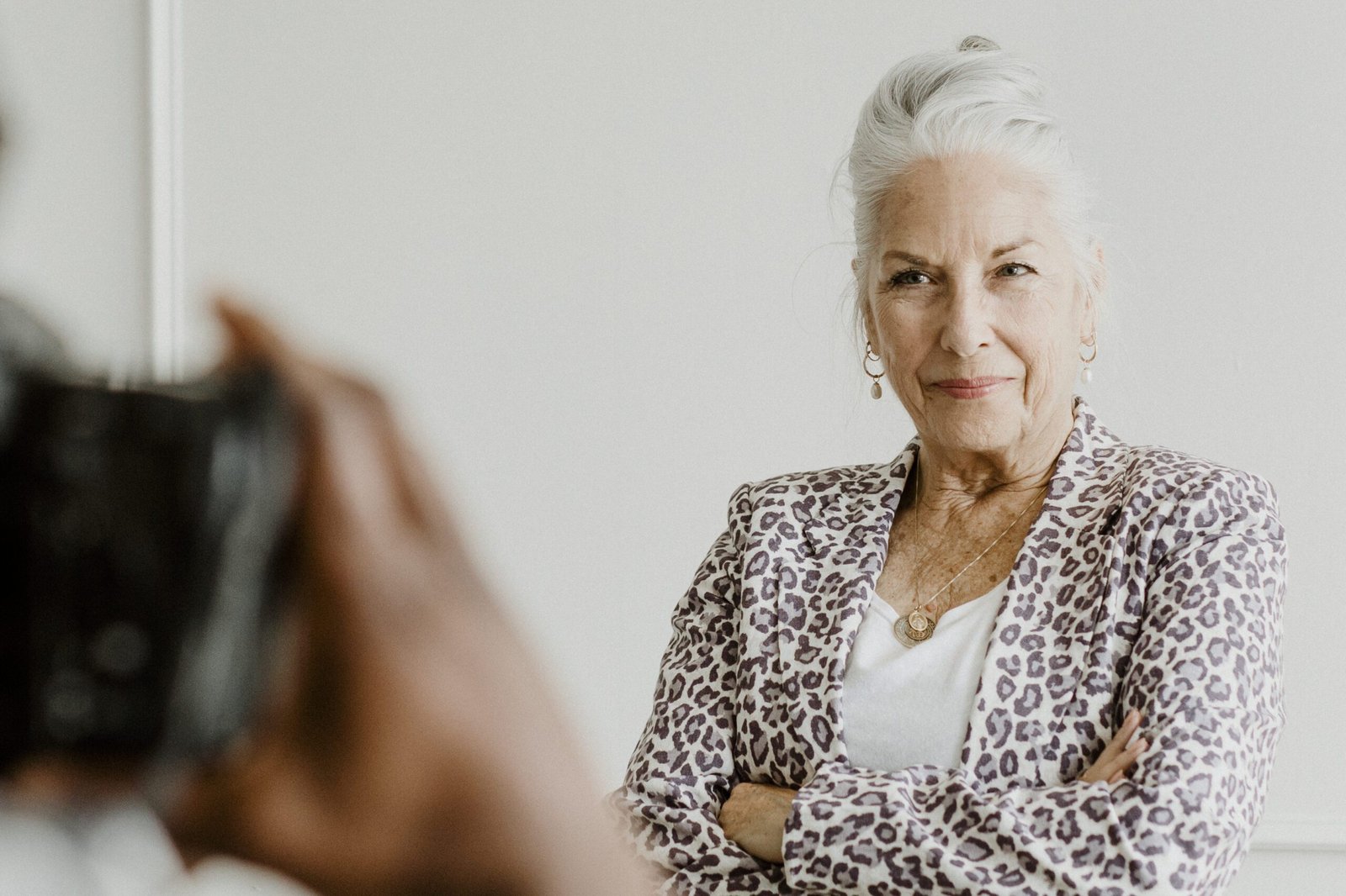 Elegant senior woman posing thoughtfully for a portrait session