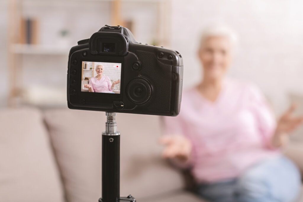 Senior woman recording a legacy film interview at home