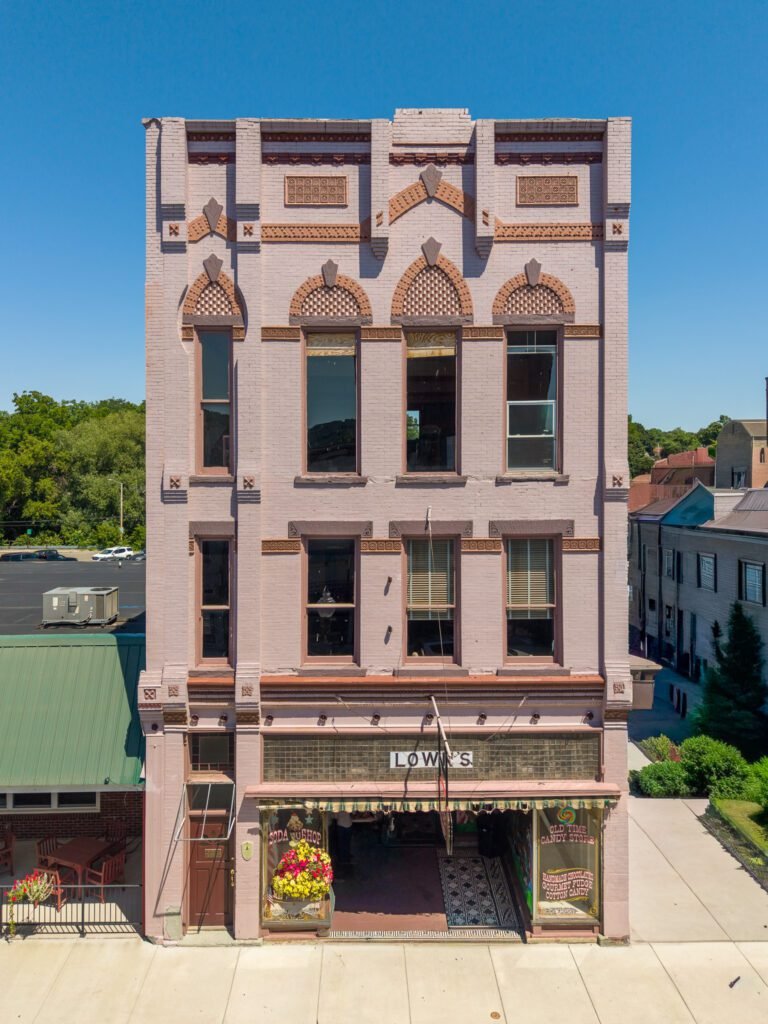 Ornate three-storey brick building in Penn Yan housing a soda shop and old-time candy store