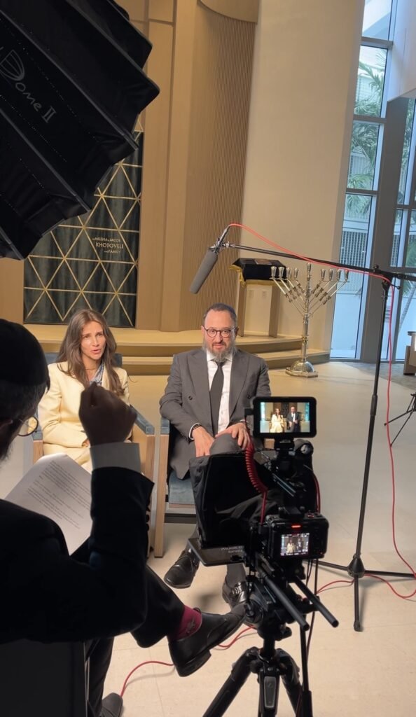 Behind the scenes on a legacy film session with a couple seated for interview