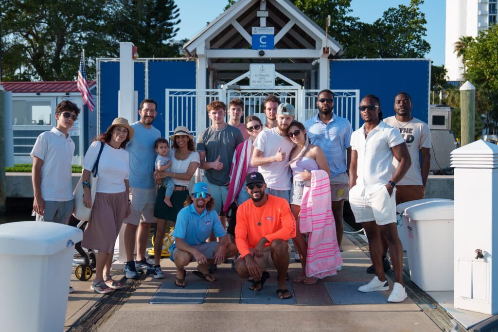 The full group of guests gathered on the dock in front of the Sea Rocket ticket booth in Fort Lauderdale before the sunset cruise