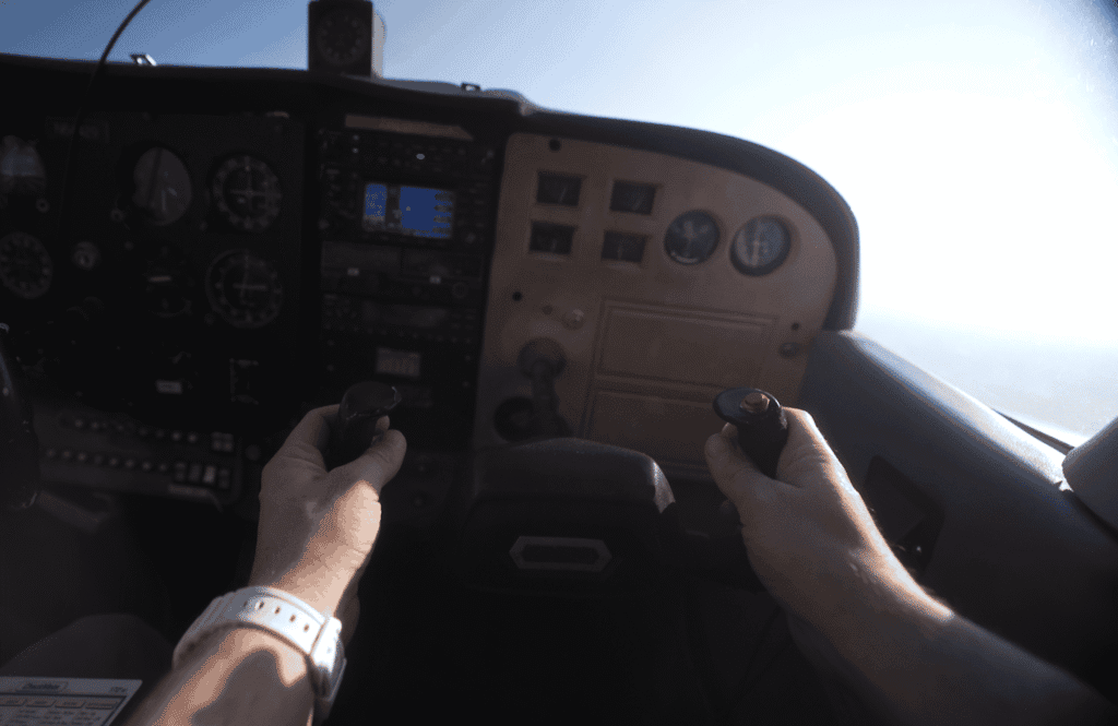 Dov Gurewicz with his hands on the yoke of the private plane out of the Space Coast