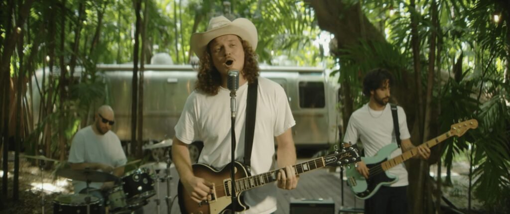 The James Malcolm Band performing in front of the vintage Airstream at 1000 Palms Hideout during the Knock on Marble music video shoot