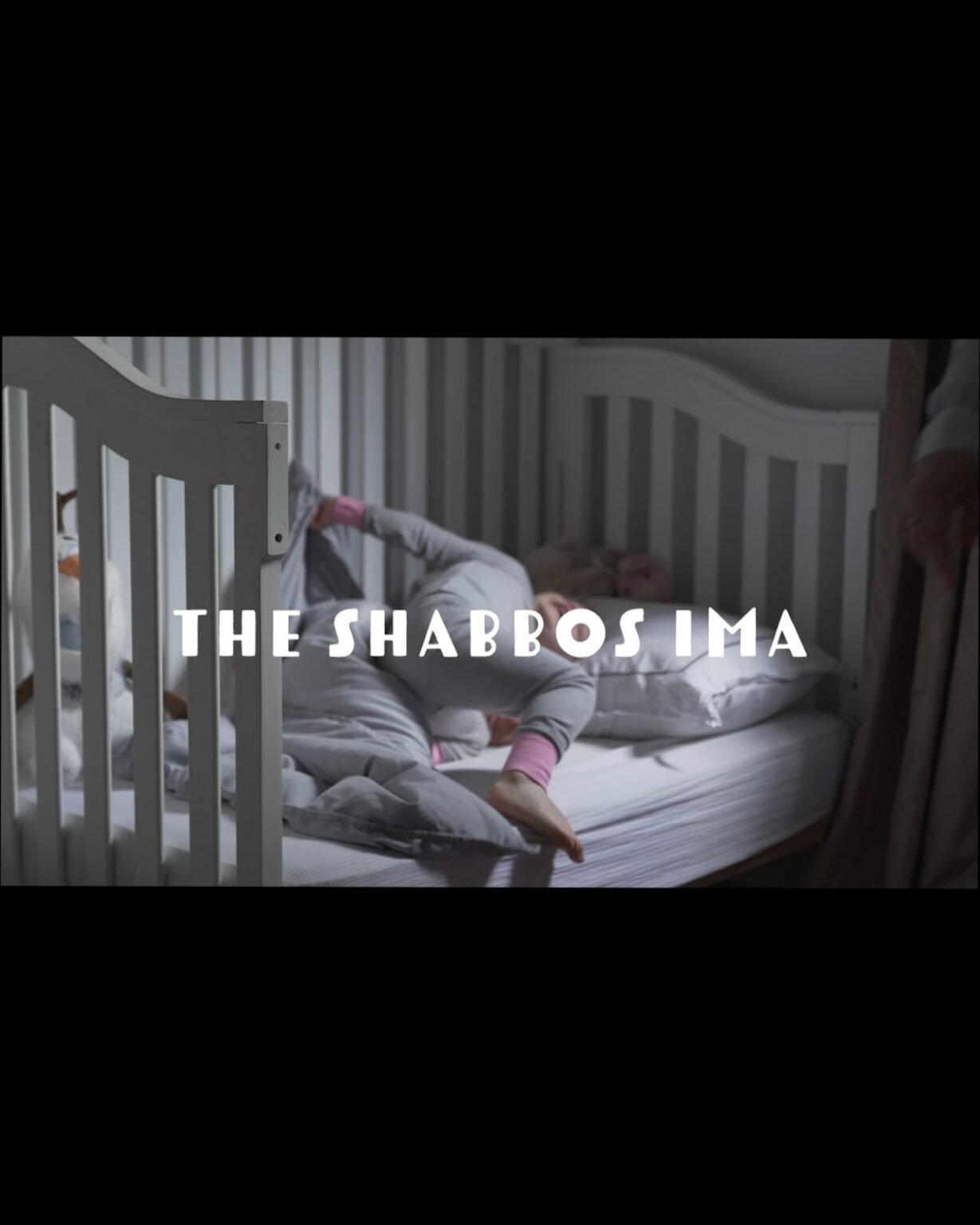 Ruby in bed in the opening frame of The Shabbos Ima, before the morning starts