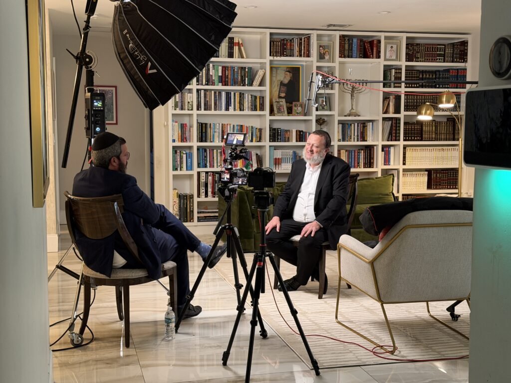 Legacy film session in progress with interviewer and subject seated facing each other