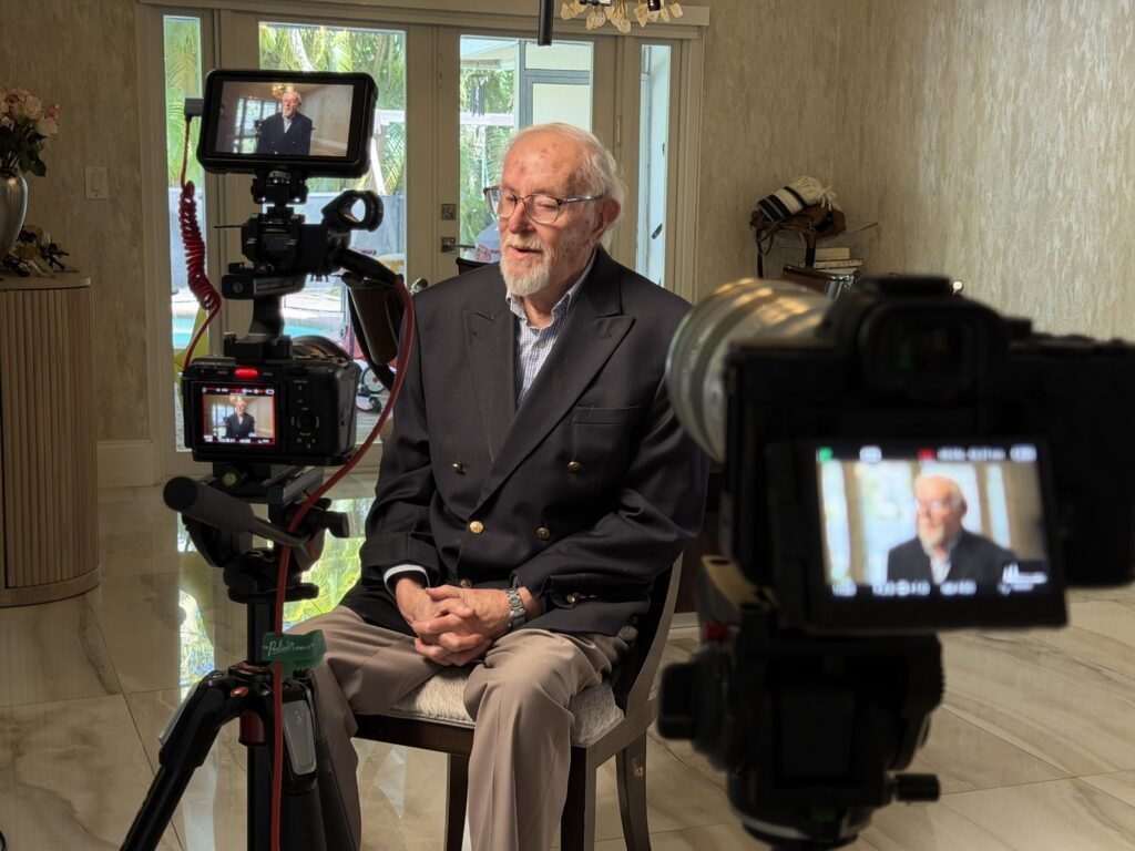 Filming a legacy film interview with two cameras and a monitor